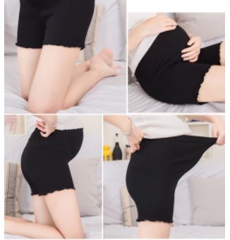 Zwangere vrouw draagt een ademende zwangerschapsbuikband voor optimale buiksteun en comfort.