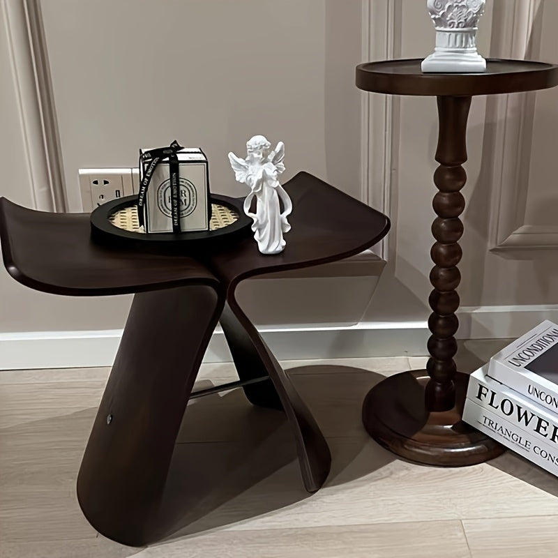 Elegante vlinderkruk, tijdloos design zitmeubel van massief hout. Perfect voor woonkamer of entree.