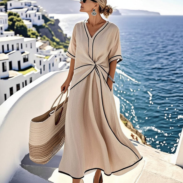 Stijlvolle lange dames maxi-jurk met V-hals. Ideale zomerjurk voor zowel casual als elegante gelegenheden.