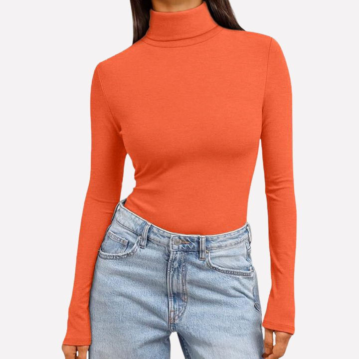 Modieuze dames top met coltrui en lange mouwen, creëert moeiteloos diverse looks.