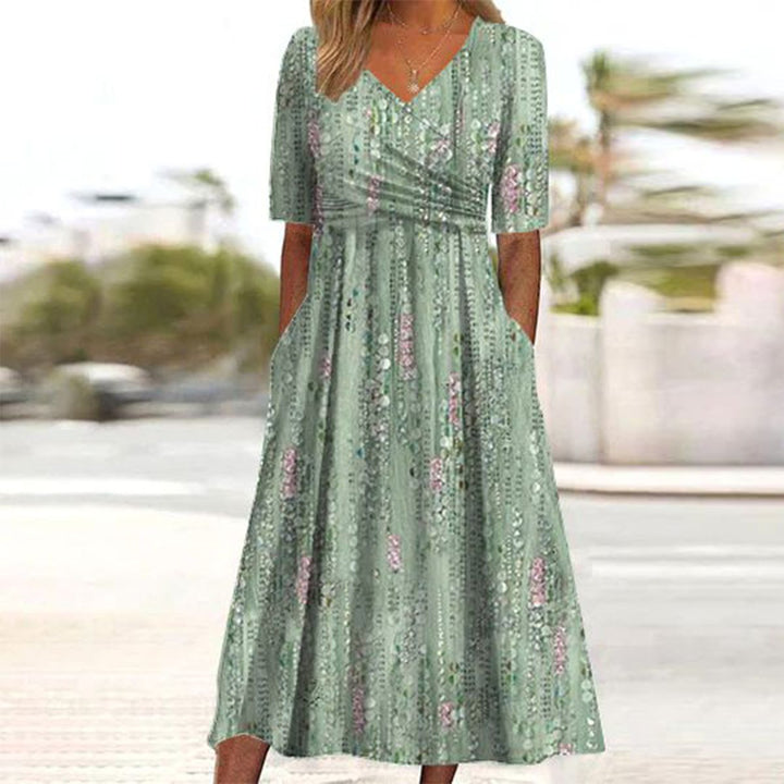 Elegante dames midi jurk met V-hals, veelzijdig en comfortabel voor elke gelegenheid; perfecte lente- en zomerjurk.
