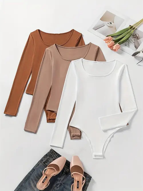 Modieuze damesbodysuits in 3-pack, effen design met lange mouwen voor veelzijdige outfits.