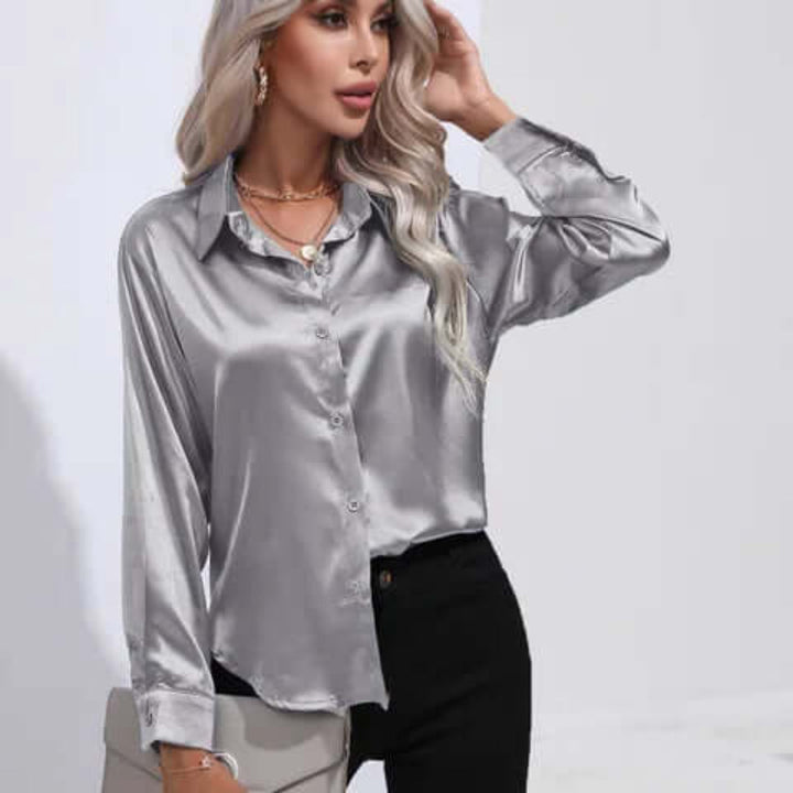 Casual chique damesblouse met lange mouwen, losse pasvorm en een glanzende afwerking.