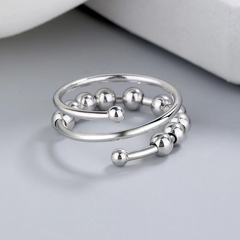 Unisex fidget ring met zilveren kralen voor stressverlichting en kalmte.