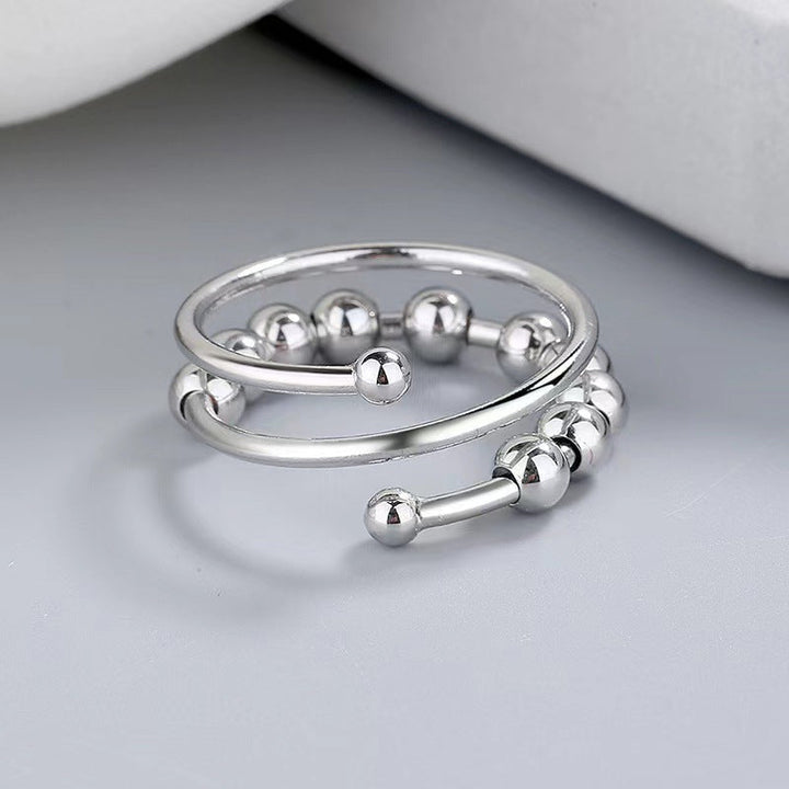 Unisex fidget ring met zilveren kralen voor stressverlichting en kalmte.