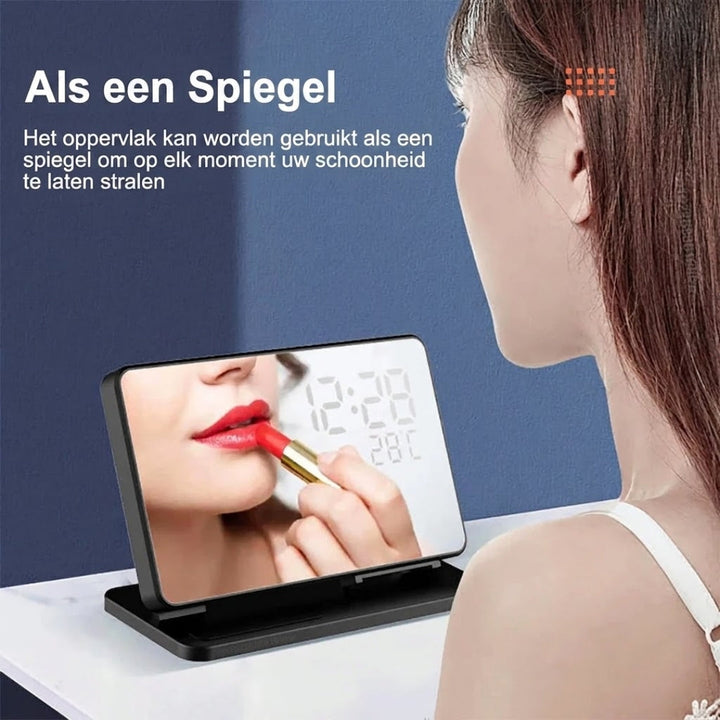 Moderne zwarte 3-in-1 oplader met wekker, snellaadfunctie voor je mobiel, smartwatch en oordopjes.