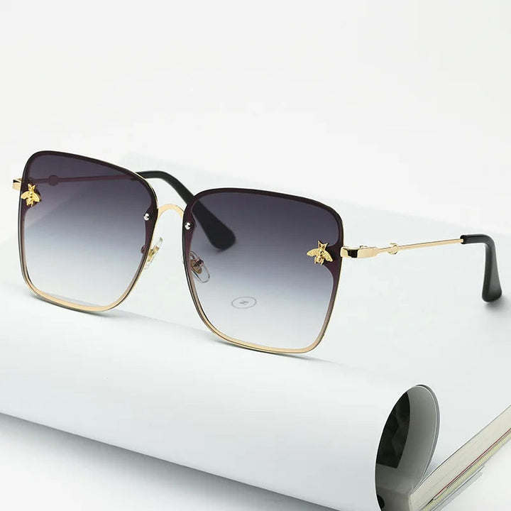 Trendy dames randloze zonnebril met gradient glazen. Oversized model voor optimale stijl en bescherming.