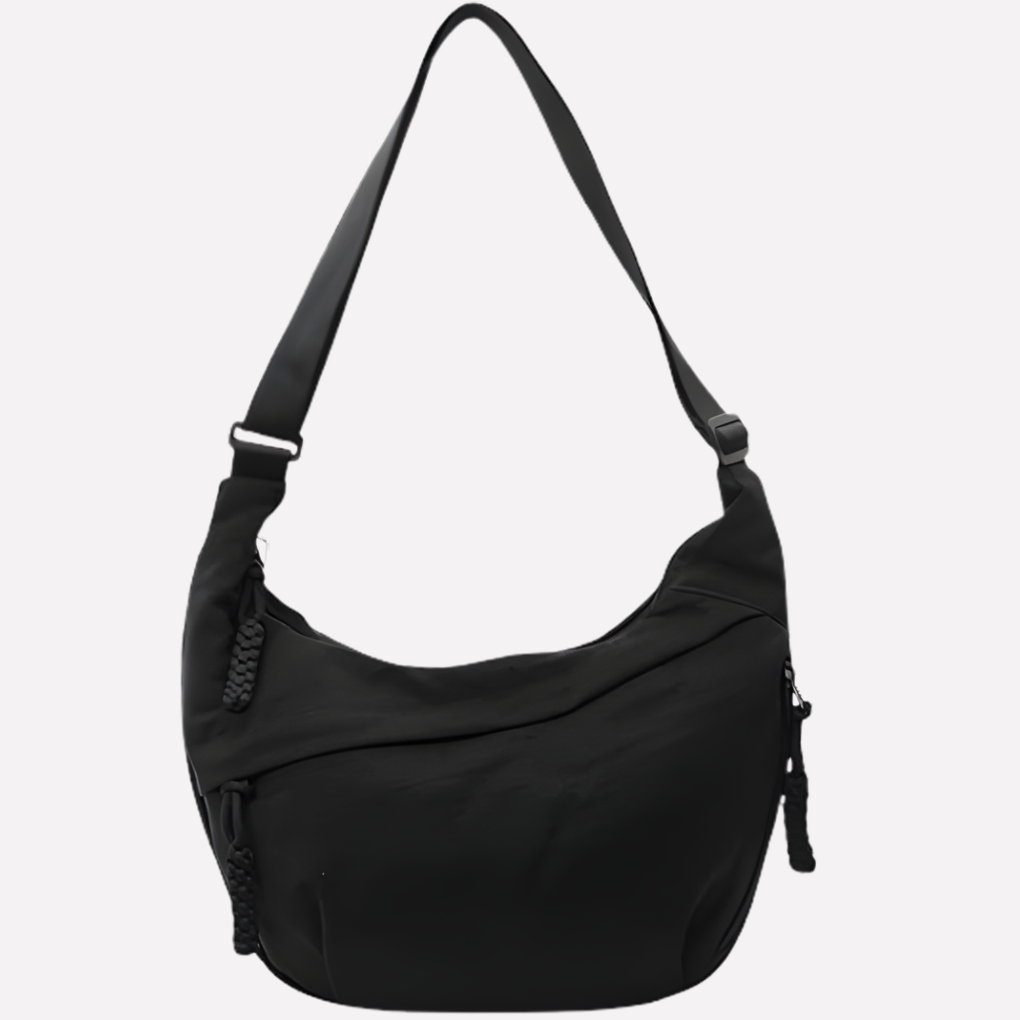 Casual dames crossbodytas, model halvemaan. Deze nylon tas is een handig mode accessoire in diverse kleuren.