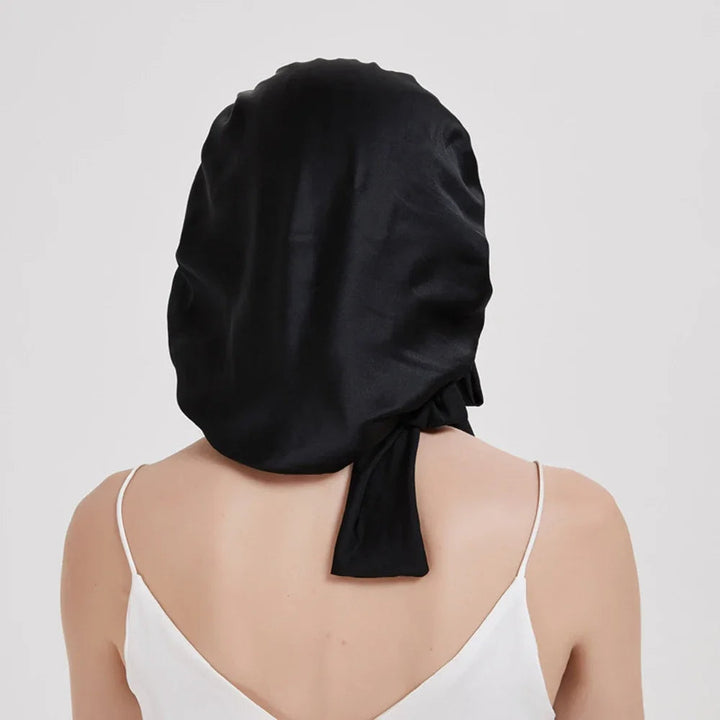 Ultieme haarverzorging voor vrouwen: luxe moerbeizijden slaapmuts voorkomt pluis en knopen effectief.