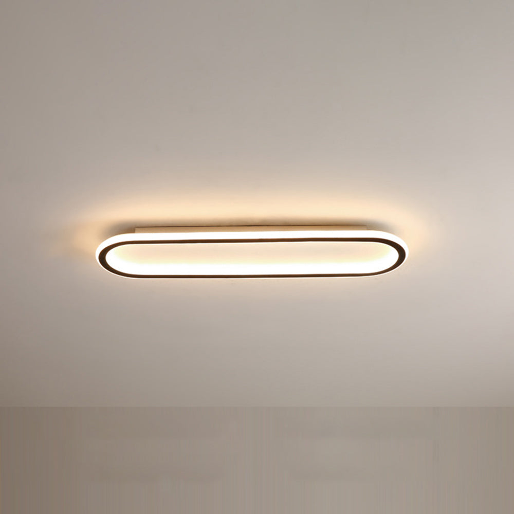 Close-up van de zwarte metalen en acryl afwerking van de elliptische LED plafondlamp. (94)