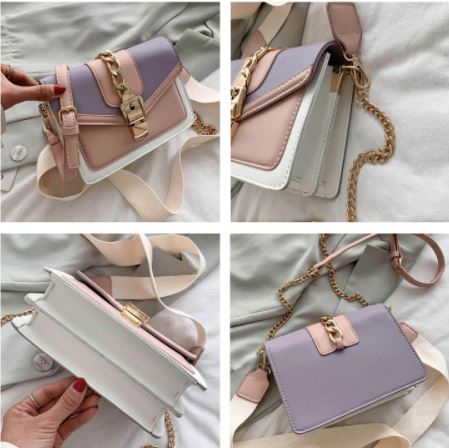 Elegante schoudertas voor dames: zwarte sling bag van PU leer met chique kettingaccenten.