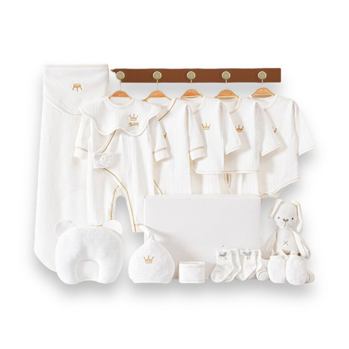 Zachte gebreide babymuts voor pasgeborenen, onderdeel van een complete luxe babykleding set, perfect als cadeau.