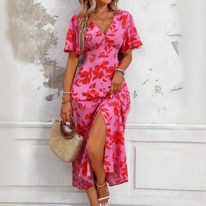 Trendy dames midi jurk met bloemenprint, ideaal als zomerse of casual jurk met een chique split.