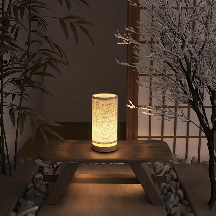 Modern LinoGlow linnenlook nachtlampje creëert warme en gezellige sfeer als leeslamp in de slaapkamer.