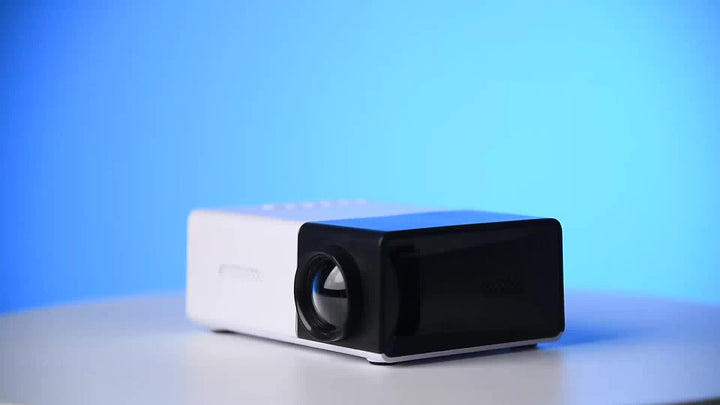 Compacte mini LED projector met ingebouwde speakers; ideaal voor draagbaar entertainment en thuisbioscoop.