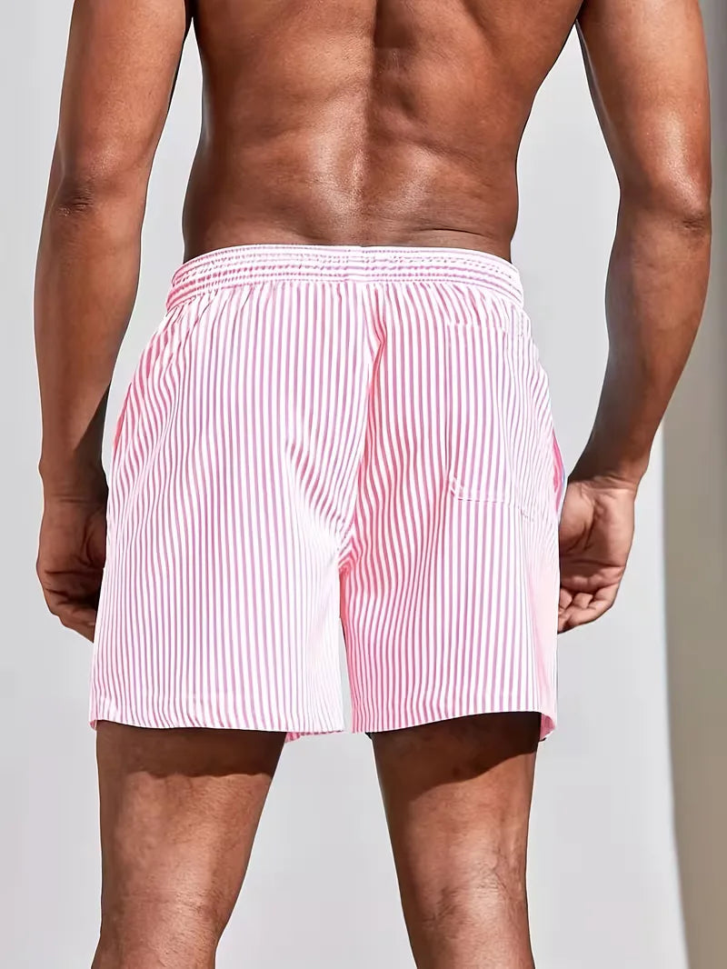 Gestreepte heren zwembroek, blauw-roze design, biedt comfort en stijl voor elke strand- of zwembadsessie.
