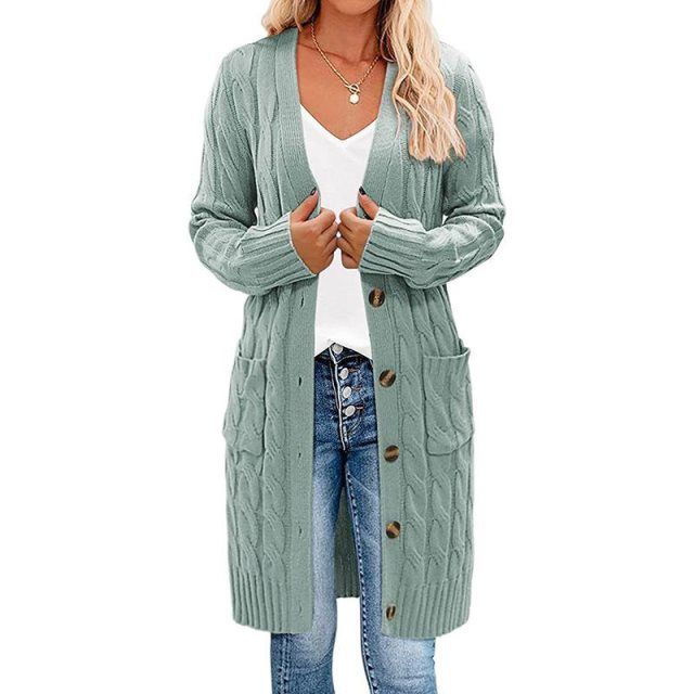 Comfortabel lang damesvest, gedraaid gebreid. Perfect voor warmte en stijlvolle kleding tijdens koude herfstdagen.