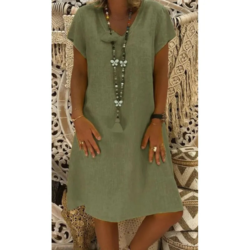 Elegante dames midi-jurk met V-hals en kapmouwen. Comfortabele losvallende zomerjurk voor casual gelegenheden.