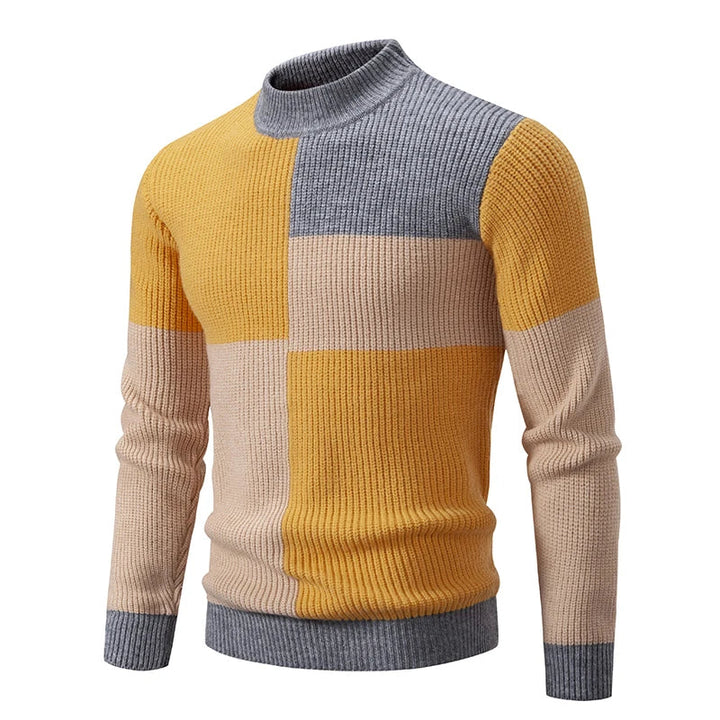 Gekleurde patchwork heren trui. Slim fit design, comfortabel en modieus voor de koudere dagen.