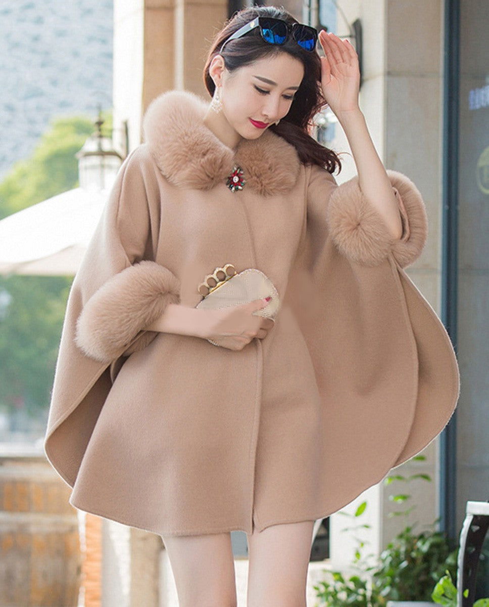Stijlvolle winterkleding voor vrouwen: een warme, comfortabele damesjas met losse pasvorm en elegante details.