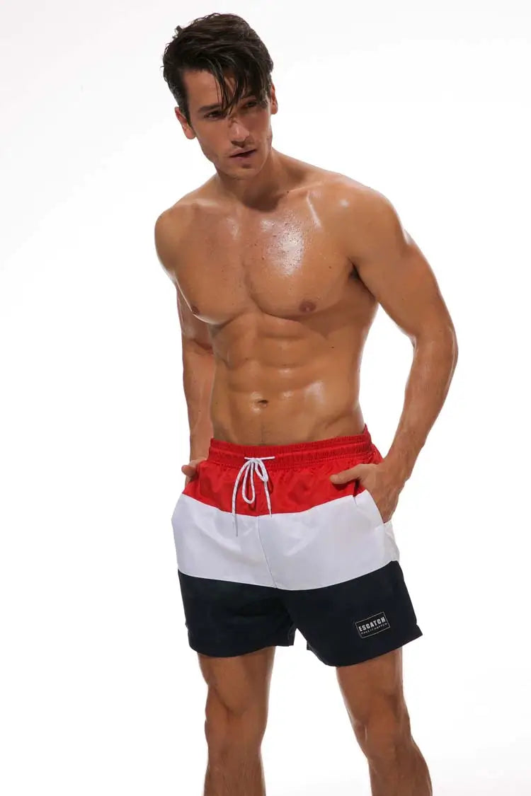 Achterkant heren boardshorts met praktische zak; comfortabele sneldrogende zwemkleding voor strand & sport.