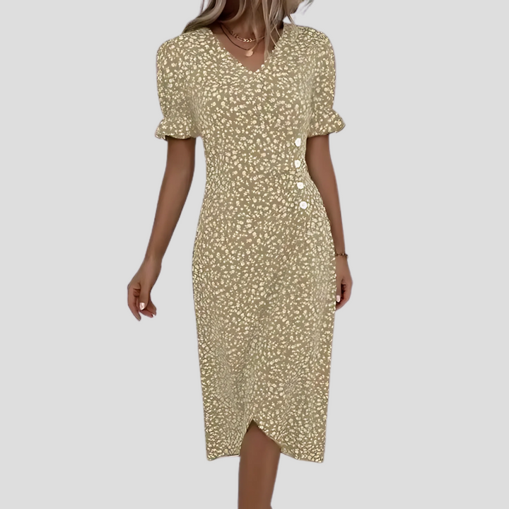 Elegante midi damesjurk met bloemenpatroon, V-hals, korte pofmouwen en een flatterende A-lijn.