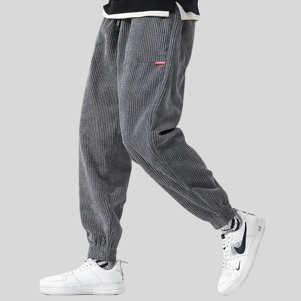 Heren corduroy joggingbroek met wijde pijpen in klassiek grijs, ideaal voor casual streetwear en comfortabele vrijetijd.