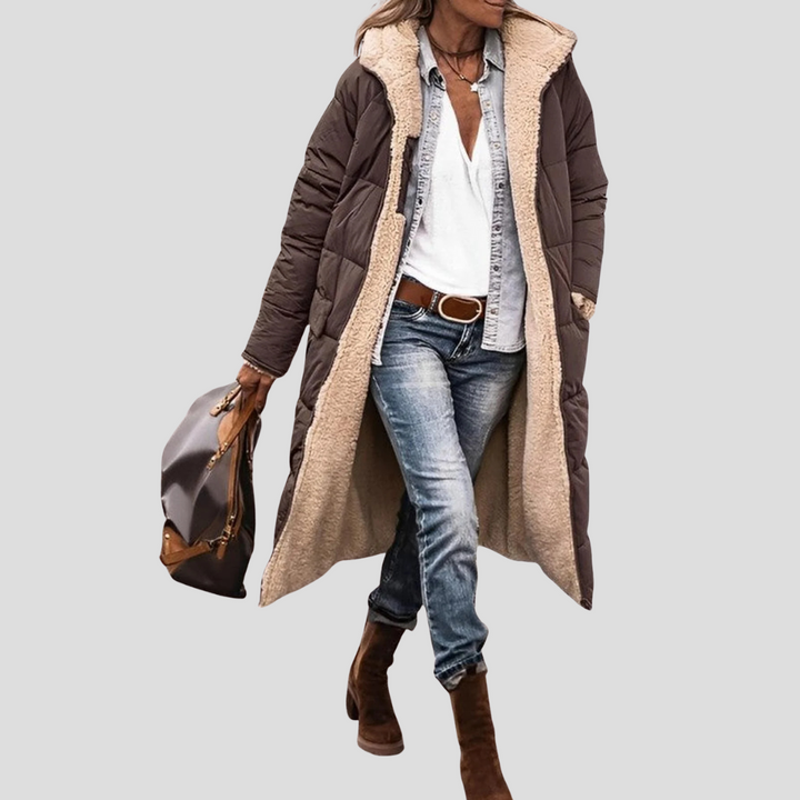 Elegant lange dames winterjas, omkeerbaar design met comfortabele teddy voering en capuchon.
