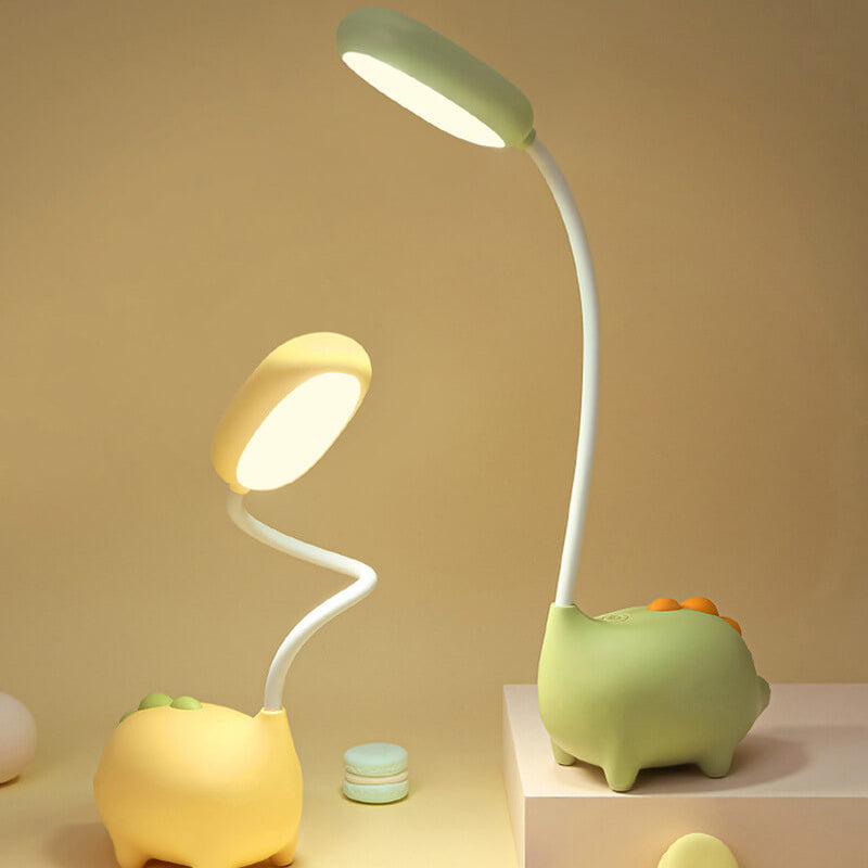 Oogvriendelijke LED tafellamp met speels dinosaurus design, ideaal voor slaapkamer.