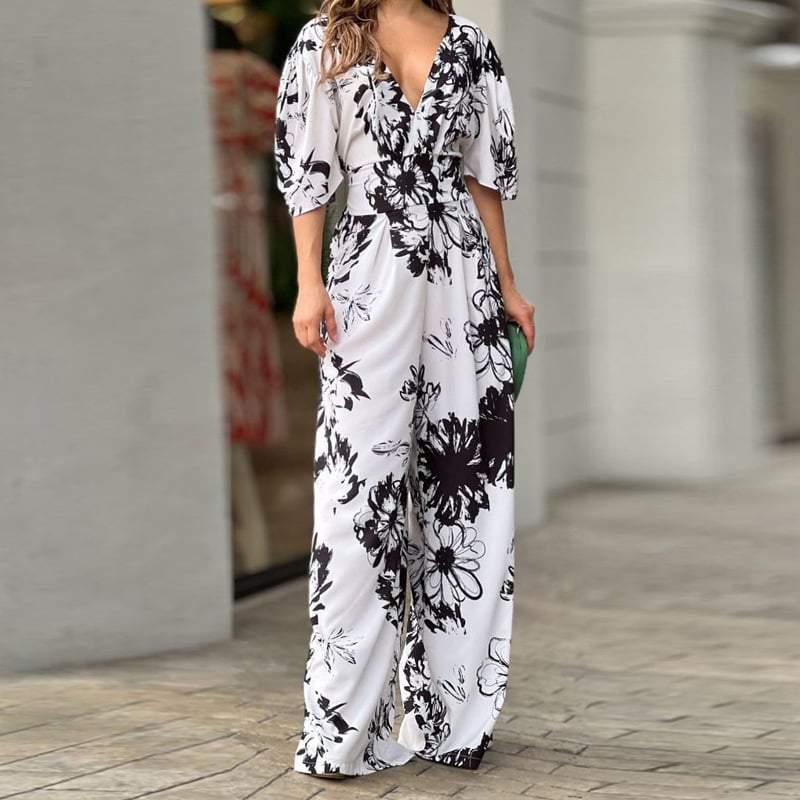Zomerse dames jumpsuit met zwierige wijde pijpen en stijlvolle bloemenprint, ideaal voor elke gelegenheid.