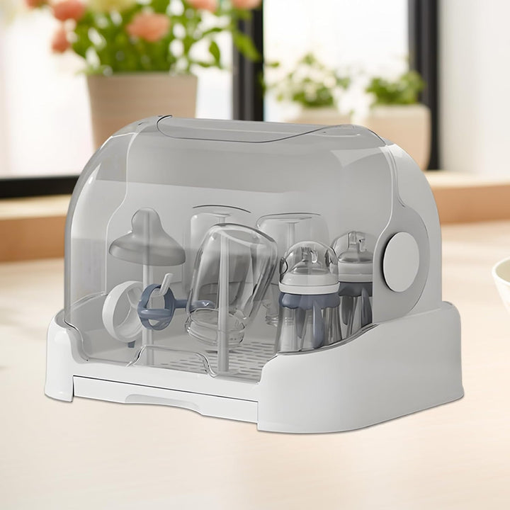Compacte flesdroger met opbergdoos en deksel, ideaal voor hygiënisch drogen en bewaren van babyflessen.