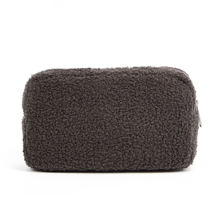 Grijze fluwelen make-uptas, een praktische en elegante cosmetische organizer voor dames beauty producten.