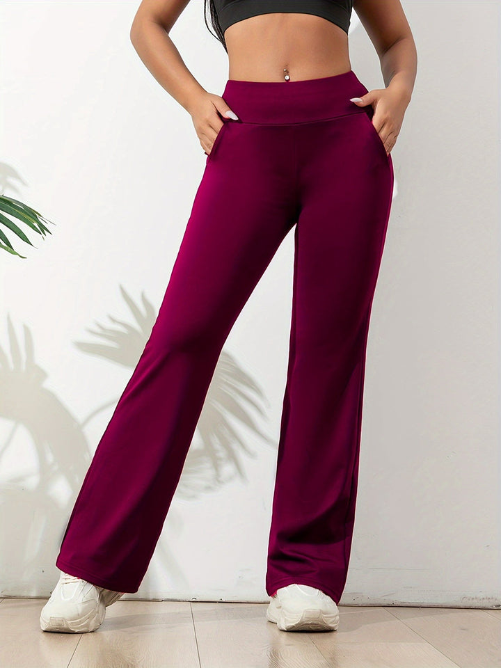 Marineblauwe comfortabele dames yogabroek met flared pijpen, perfect voor sportkleding en vrije tijd.
