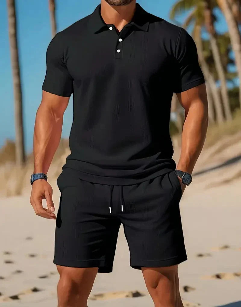 Detail van de ademende stof van de heren tweedelige zomer set. Breisel met shorts en T-shirt met korte mouwen.