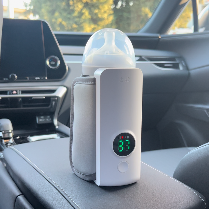 Draagbare oplaadbare flessenwarmer voor baby's, ideaal onderweg. Verwarmt snel moedermelk of flesvoeding.
