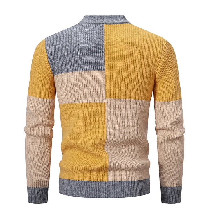 Trendy heren patchwork trui, ideaal voor een casual of stijlvolle herfst/winter outfit.