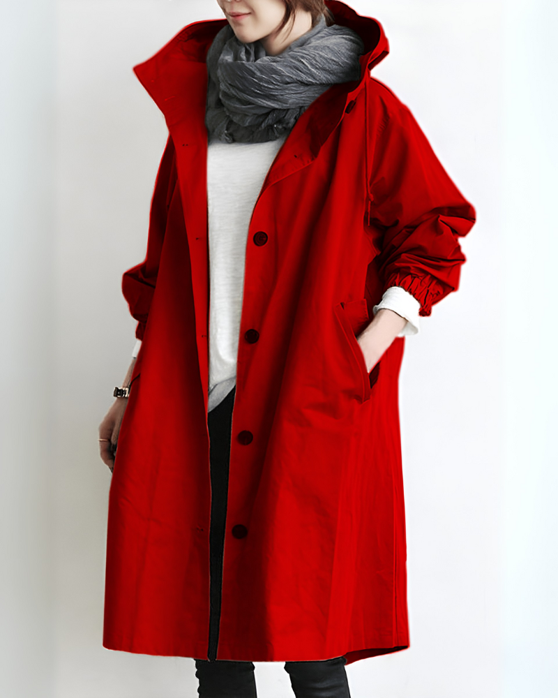 Lange dames trenchcoat met capuchon, ideaal voor een stijlvolle en warme herfst of winter.