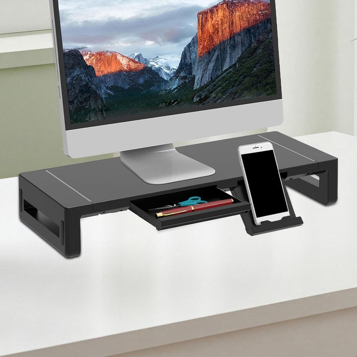 In hoogte verstelbare monitorstandaard met opberglade en USB poorten, ideaal voor kantoor.