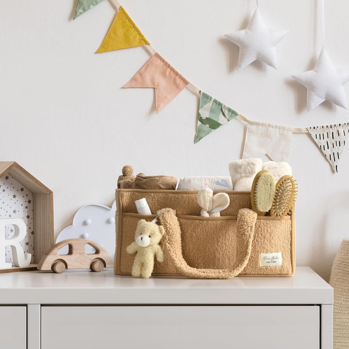 Organiseer babyspullen met deze zachte sherpa opbergmand met handige vakken.