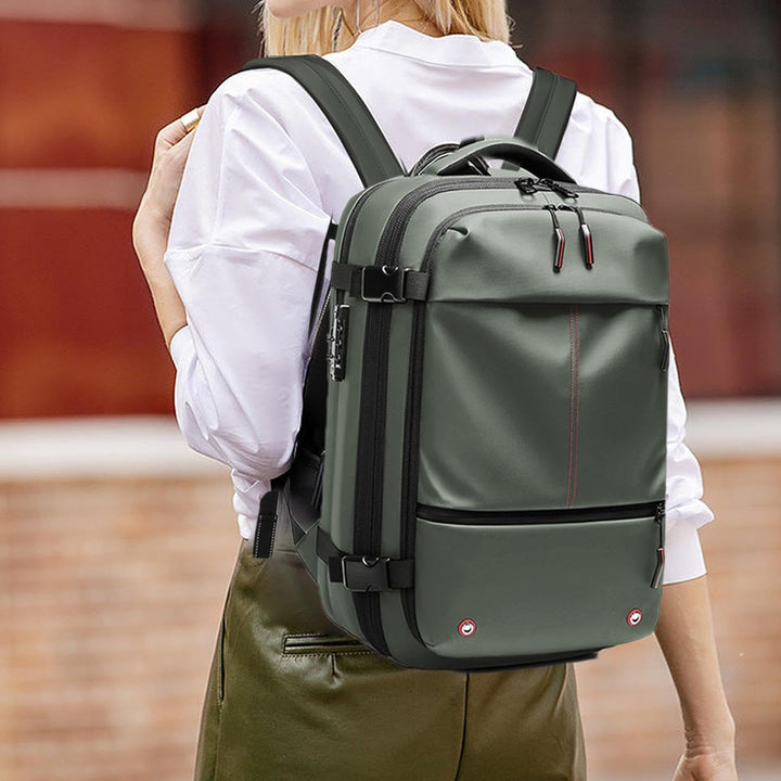 Legergroene waterdichte reisrugzak 60L, uitbreidbaar, vacuümfunctie, perfect voor laptop & bagage.