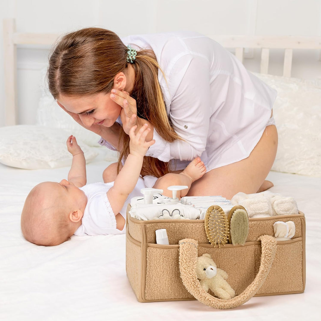 Roze sherpa luiertas caddy, pluche opbergmand met vakken voor babybenodigdheden.