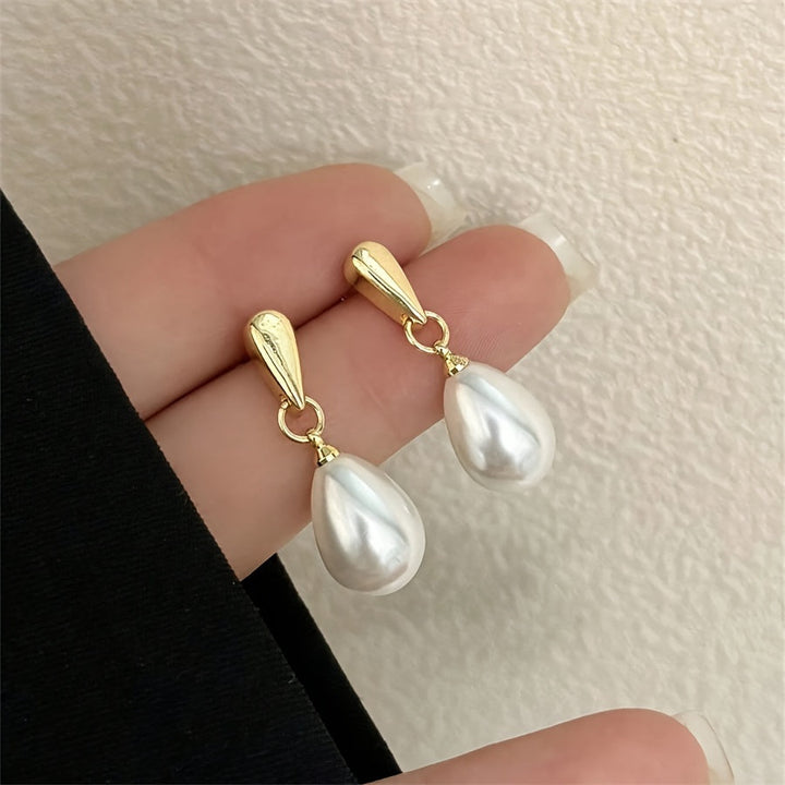 Luxe dames hangende oorbellen, elegant en stijlvol voor bruiloft of feest. Gouden sieraden voor speciale gelegenheden.
