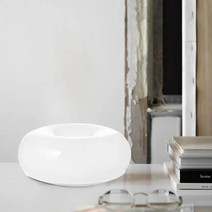 Moderne glazen donut lamp, oranje LED, te gebruiken als tafel- of wandlamp in de woonkamer.