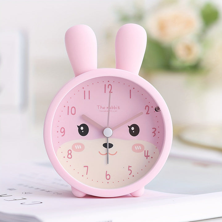 Roze BunnyTime kinderwekker met stil uurwerk en zacht nachtlampje voor rustige ochtenden in de kinderkamer.