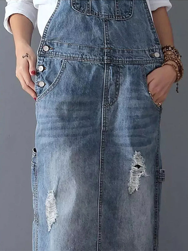 Trendy dames denim dungaree jurk met rugsplit in donkerblauw; veelzijdig, comfortabel en modieus.