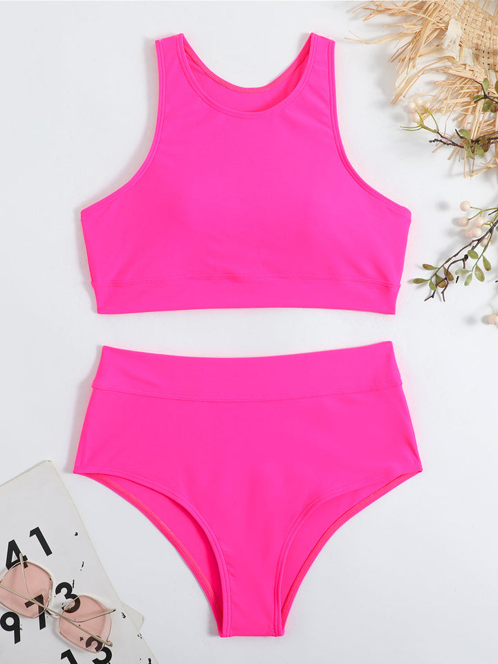 Ondersteunende racerback damesbikini met stijlvol high-waist broekje. Comfortabele zwemkleding voor elke vrouw.