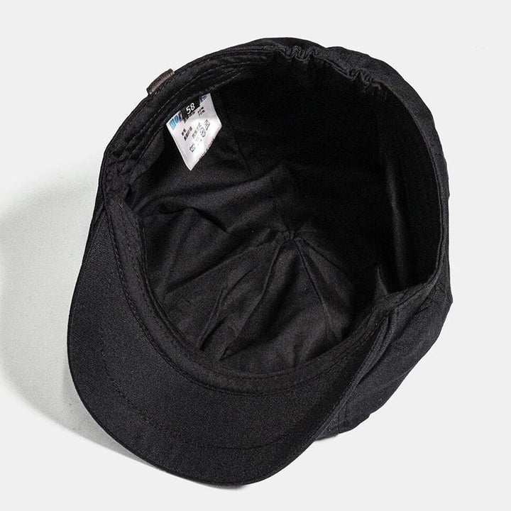 Heren zwarte retro flatcap, een iconisch hoofddeksel dat mode en historie combineert.