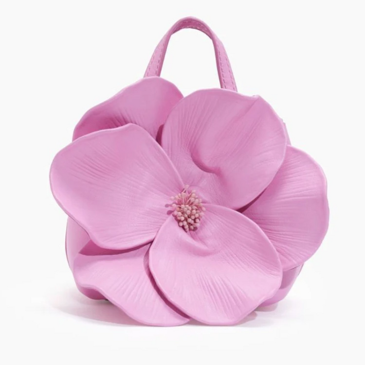 Close-up van de compacte dames mini schoudertas met gedetailleerd bloemenpatroon in roze tinten.