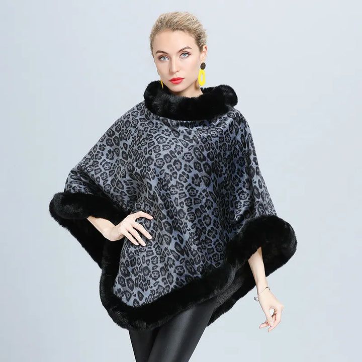 Stijlvolle dameskleding: trui-poncho met soepele val, comfortabel en warm voor winterse outfits.