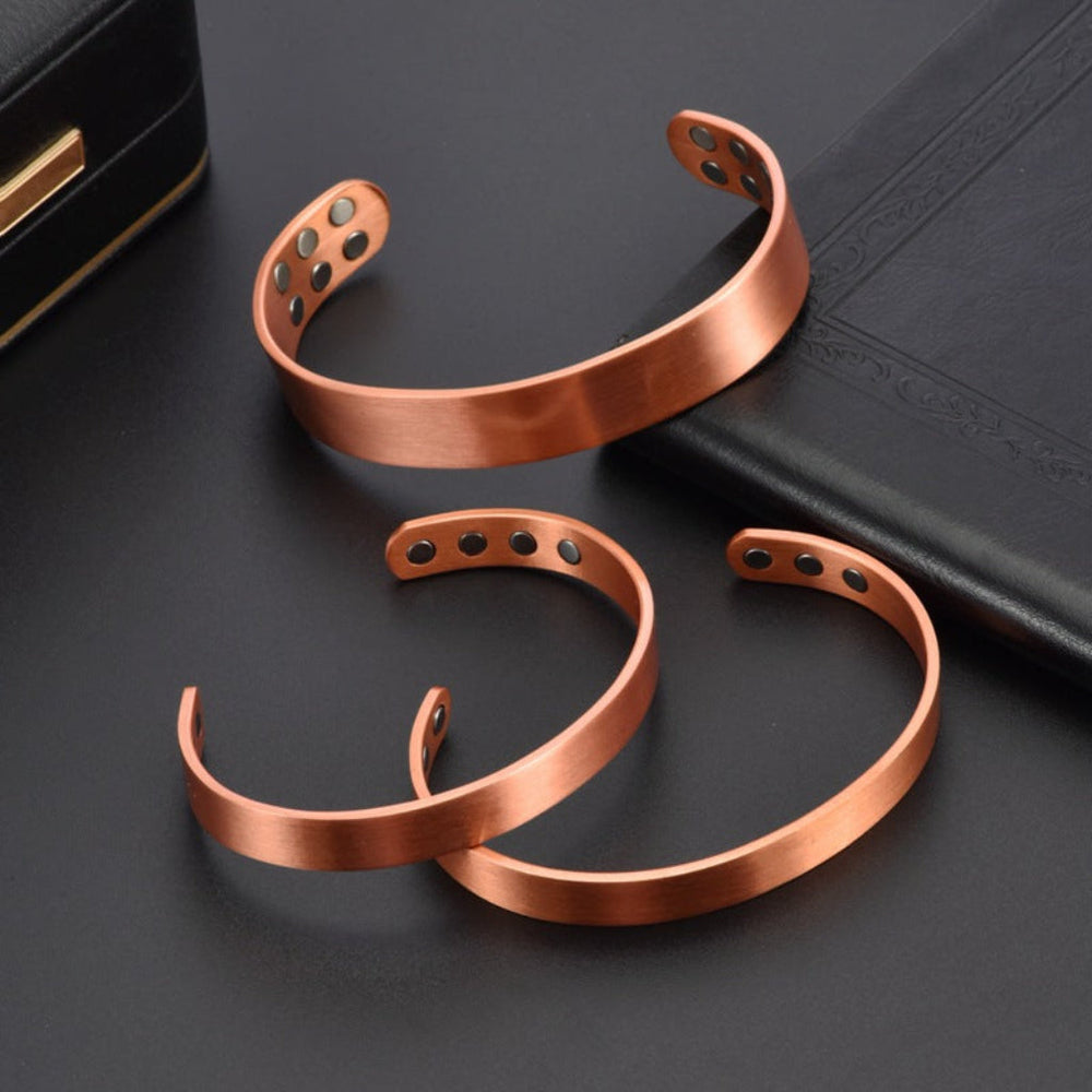 Magnetische koperen armband en ring. Energetische, minimalistische unisex sieraden voor dames en heren.